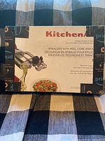 Front of KitchenAid spiralizer attachment box showing product image and description.