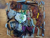 Full overview of collection showcasing various vintage hair accessories laid out on wood surface.