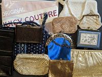 Full assortment of assorted vintage ladies' purses including beaded evening bags, clutch purses, and other handbags showing various colors, materials, and wear.