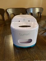Front view of Lumin CPAP mask cleaner showing brand logo and LED indicators