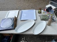 Photo showing all trays and miscellaneous items including vintage Pepsi bottle and small lantern placed on table.
