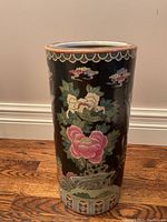 Front view of cylindrical umbrella stand with black ground, peony and bird painting