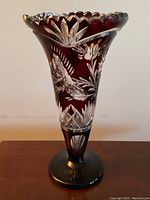 Full view of vase showing shape, color, rim and pedestal base