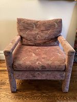 Front view of lounge chair showing seat, arms and back cushion