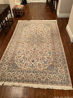 Full overhead view of entire rug on hardwood floor