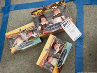 Three boxed sets of The Pilgrim Pair figurines, each set with two salt and pepper shaker figurines in original packaging.