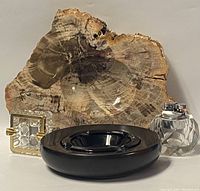 Front view of the vintage ashtrays and glass table lighter arranged together for visual identification and condition review.