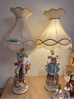 Both lamps displayed side by side on a table with shades on