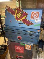 Front and top view of blue Victor toolbox with stickers and multiple drawers