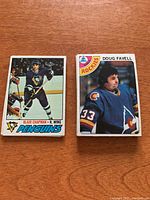 Two close-up photos of vintage Topps NHL hockey cards showing players Blair Chapman (Pittsburgh Penguins) and Doug Favell (Colorado Rockies).