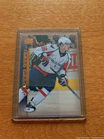 Front view of Chris Bourque Young Stars rookie hockey card in protective casing showing full player image and card details.