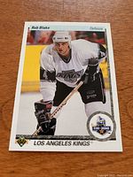 Front image of the Rob Blake rookie card from 1990/91 Upper Deck hockey series showing Blake in Los Angeles Kings uniform.