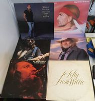 Six Willie Nelson LPs with front album covers visible including Somewhere Over the Rainbow, City of New Orleans, Sweet Memories, Partners, The Troublemaker, To Lefty From Willie.