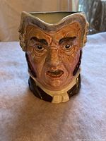 Front view of the Royal Doulton Toby mug showing detailed face with brown hair sideburns and expressive features.