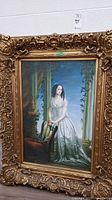 Front view of the oil painting and ornate gilded wood frame