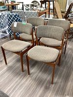 Group of four teak framed chairs with upholstered seats and backs