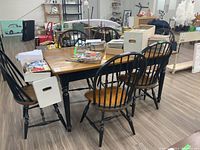 View of entire dining set: rectangular table and six Windsor chairs