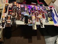 Overview of multiple brand hair extension packages laid out showing colors and packaging