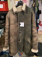 Front view of a men's sheepskin wool jacket by Zanelli showing button closure, shearling collar, and pockets.