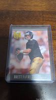 Front of Brett Favre Ultra Draft Picks rookie card showing football action pose in Falcons uniform.