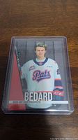 Front of the Connor Bedard Pre Rookie hockey card showing his image in a Regina Pats jersey with the card series and player name.