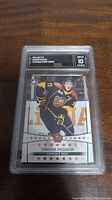 Front of encapsulated card showing 2014 Leaf Canada's Best Connor McDavid rookie card and GMA grade 10 label