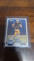 Front side of Josh Allen rookie card showing action shot and rookie designation.