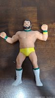 Front view of LJN wrestling action figure of Billy Jack Haynes showing muscular body, beard, yellow trunks, white boots with green stripes, and wristbands.