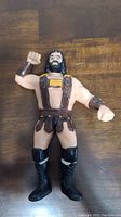 Front view of the LJN Hercules Hernandez action figure showing its facial features, gladiator outfit, and boots.