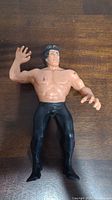 Front view of the Ricky Steamboat action figure showing the detailed facial features, sculpted black hair, bare chest, and black pants and boots.