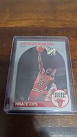 Front of Michael Jordan basketball card showing him in Chicago Bulls jersey scoring a basket.