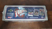 Top view of the unopened 1991 Upper Deck NFL Football Premier Edition factory set box, showing the branding and promotional text about the complete set and count of 700 cards.