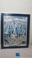 Full view of the framed signed ski resort poster showing mountain, trails, and signature.