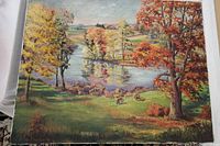 Front view of oil on canvas painting showing autumn landscape, water body, and grazing animals.