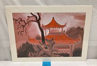 Painting showing Chinese pagoda with orange roofs, surrounding trees, and a pink-toned sky, signature visible in top right corner.