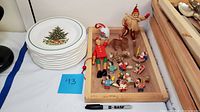 Six Pfaltzgraff Christmas plates stacked, showing decorated Christmas tree and toy design