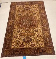 Full view of the vintage oriental traditional rug showing the overall design and border.
