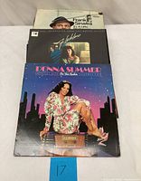 Front view showing Donna Summer Greatest Hits, Barbra Streisand Guilty, and Frank Sinatra Try A Little Tenderness record covers stacked.