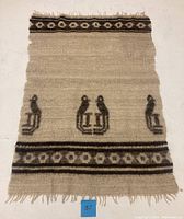 Full flat-lay photo of the vintage wool tapestry rug, showing the overall design, colors, and fringed edges.