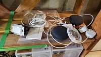 Overview of the Google Nest smart speakers and Lutron Caseta switch with wiring and mounting components.
