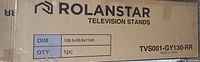 Box of Rolanstar television stand model TVS001-GY130-RR showing dimensions 108.5x36.5x111cm