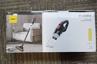 Box of the multifunction vacuum cleaner ST-6608EG by Zuolun with image showing vacuum in upright and handheld modes