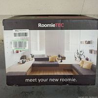 Front of RoomieTEC vacuum cleaner box displaying brand name