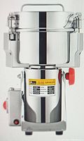 Front view of stainless steel grinder with label and red knob