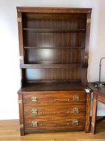 Front view of Stanley bookcase with three drawers, showing shelves and drawer hardware.
