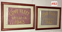 Both framed pennants side by side on wall