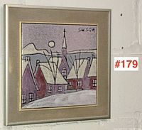 Framed ceramic tile artwork showcasing a village scene with purple and red houses, church steeple, and the artist's signature in the top right. Slight mark on matte visible.