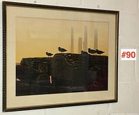 Frontal image of the orange-yellow-hued serigraph depicting silhouetted birds on logs with smokestacks in the background, framed with a bronze-toned textured frame and cream matting.