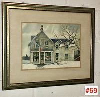 Framed watercolour artwork hanging on a wall showing a two-story building called Maple Leaf Grill