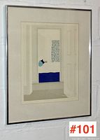 Framed screen print displayed on wall, silver metal frame and mat visible